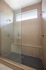 Full bathroom with a walk in shower and tile patterned floors