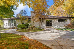 View of front of house with brick siding