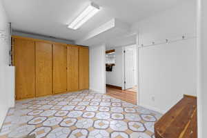 Unfurnished bedroom featuring baseboards and a spacious closet