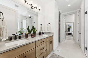 Primary bedroom en suite bathroom featuring a double vanity.