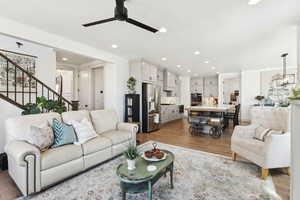 Great room showing hallway entry from the front door and stairway to the 2nd level.