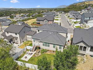 Aerial view of the warm and inviting south facing backyard.
