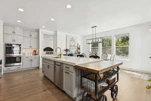 Kitchen view towards dining room and primary suite entrance.