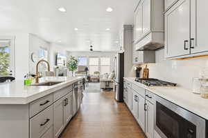 Gas cooktop, range hood and microwave.