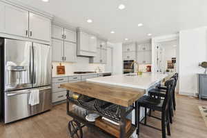 Kitchen island with storage and custom cabinetry to the ceiling. No dust collector space above your cabinetry!