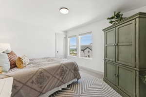 Second level bedroom just through the great space and on the north side of the home.  Spacious walk in closet.