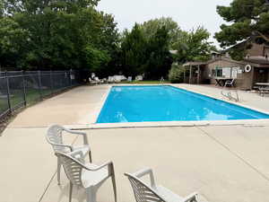 Community pool with a patio area