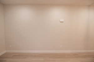 Empty room featuring light wood-style floors