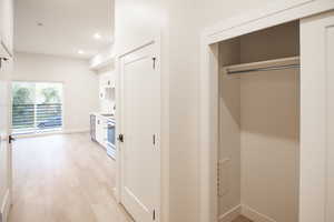 Corridor featuring recessed lighting and light wood finished floors