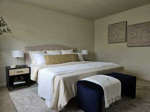 Carpeted bedroom featuring baseboards