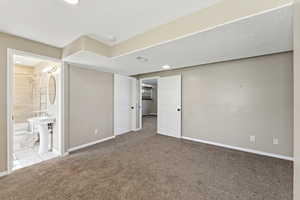 Unfurnished bedroom featuring carpet flooring and a textured ceiling