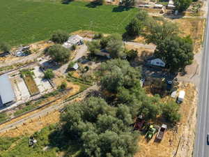 Aerial view of property and surrounding area featuring rural landscape