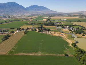 View of property location with a mountain backdrop, rural landscape, and farmland