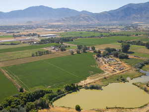 View of rural area with mountains and large plots for crops