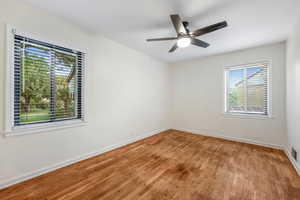 Unfurnished room with light wood-style flooring and a ceiling fan
