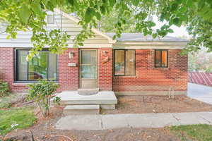 View of front of property with brick siding