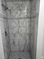 Full bathroom featuring a stall shower