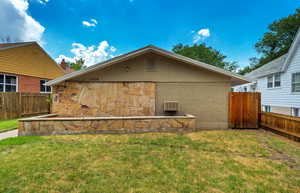 Back of house with brick siding