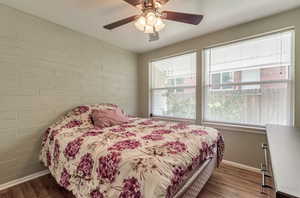Bedroom featuring wood finished floors and ceiling fan
