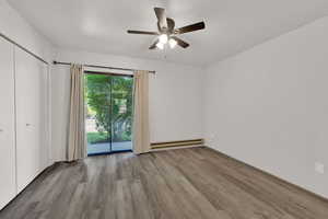 Bedroom with sliding glass door to walkout patio