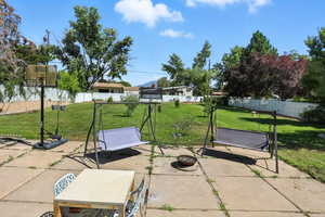 Fenced backyard featuring a patio