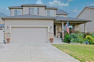 Stucco, stone finishes and relaxing porch.