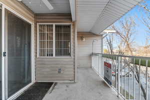 Balcony featuring a ceiling fan