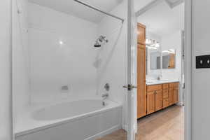 Full bath with vanity, bathing tub / shower combination, and light tile patterned floors