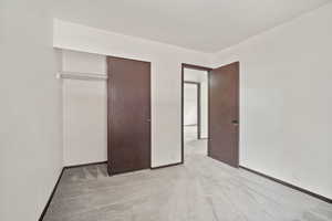 Unfurnished bedroom featuring carpet floors and a closet