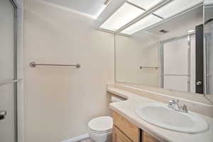 Full bathroom featuring vanity and a shower with shower door