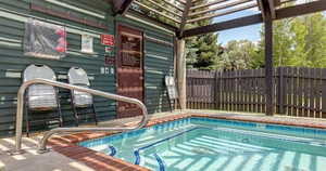 View of swimming pool with patio surround