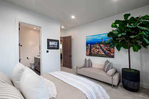 Bedroom with carpet, recessed lighting, and connected bathroom