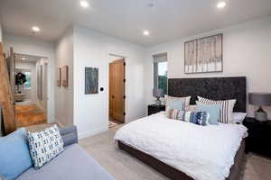 Bedroom featuring recessed lighting, multiple windows, and carpet