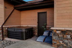 Property entrance with stone siding