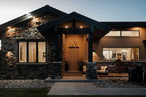 Entrance to property with stone siding