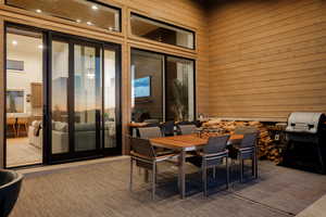 View of patio featuring outdoor dining area and grilling area