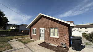 Back of house with brick siding