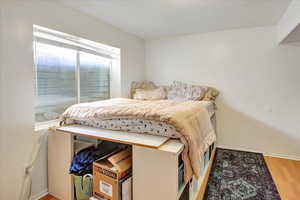 Bedroom featuring baseboards and light wood finished floors