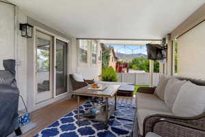 Sunroom with wood-type flooring