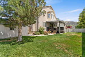 Back of house featuring a deck with mountain view and stucco siding