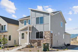 View of front of house featuring stone siding