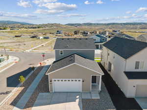 Aerial view of residential area featuring a mountain backdrop