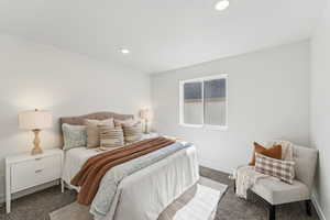 Carpeted bedroom featuring recessed lighting and baseboards