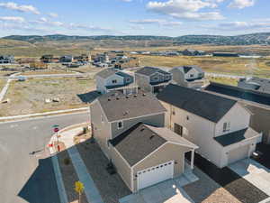 Aerial view of residential area featuring mountains