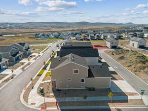 Aerial view of residential area with a mountainous background