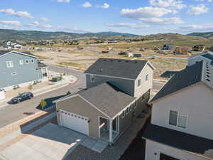 Aerial perspective of suburban area featuring a mountain backdrop