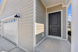 Property entrance with a garage