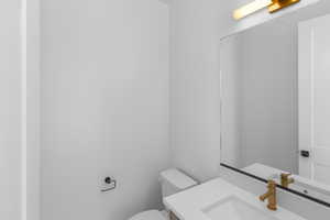 Bathroom featuring toilet and vanity