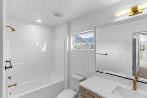 Full bath with vanity and shower / bath combination