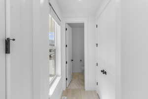 Hallway featuring light wood-type flooring